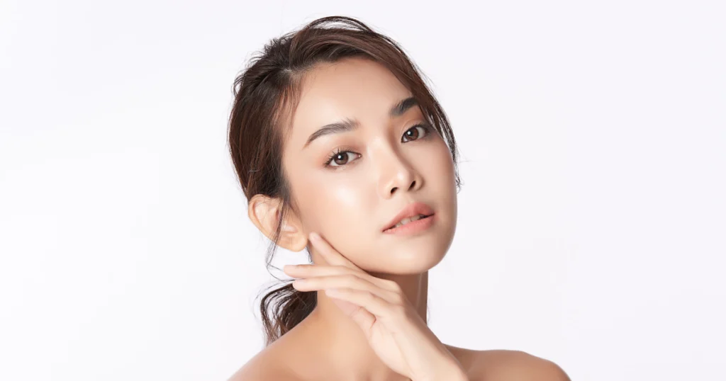 Woman with glowing skin posing after spa facials treatment in Clinton Twp, MI